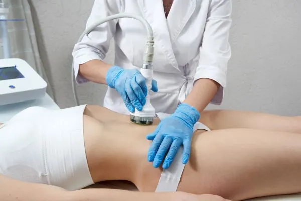 Lost the Weight but Not the Loose Skin? 2 woman having HIFU treatment on her stomach to combat loose skin Aylestone following weight loss